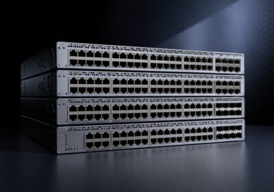 Realistic Cisco switch stack on dark background highlighting refurbished enterprise access network hardware for 2026 buyers
