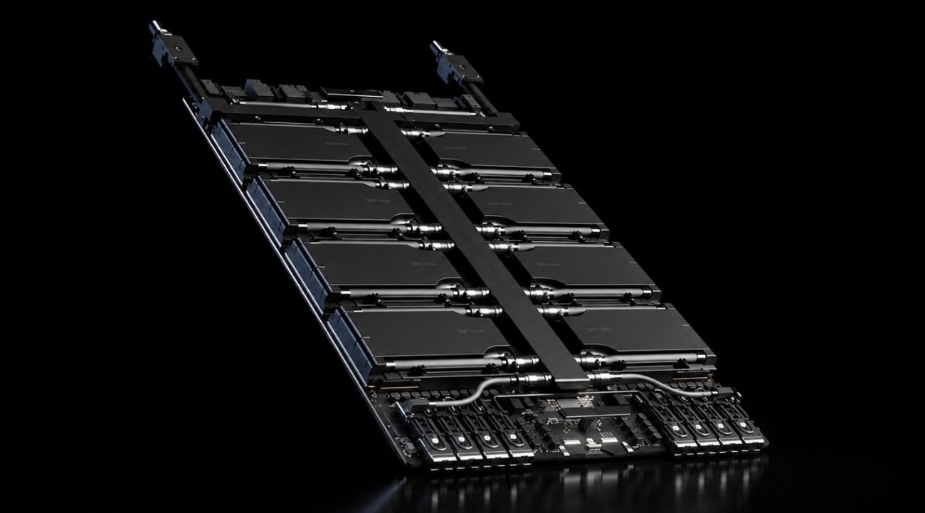HGX Rubin NVL8 8-GPU module shown against a black background, with eight large accelerator components arranged in two rows and connected by high-speed interconnect hardware.